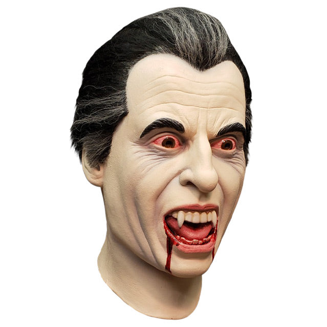 Mask, right side view, head and neck. Vampire, pale skin, black and gray hair, bloodshot eyes, vampire fangs, mouth open, blood dripping from both sides of mouth.