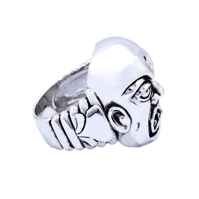 Brass ring, silver plated, right side view. Rob Zombie, Phantom Creep face, grimacing man with sharp teeth, design etched in side.