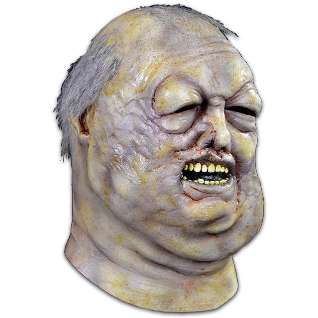 Mask, head and neck, right view. Blue and yellow discolored skin. Rotting and bloated waterlogged flesh. Salt and pepper hair. Eyes nearly swollen shut, deformed nose, mouth slightly open showing teeth.