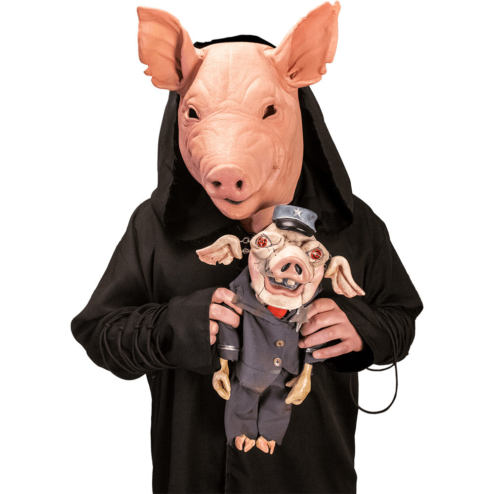 Close up of person in pig mask wearing Spiral From the Book of Saw coat. Black Coat, oversized hood, lacing ties on sleeves.  Holding Mr. Snuggles puppet prop.
