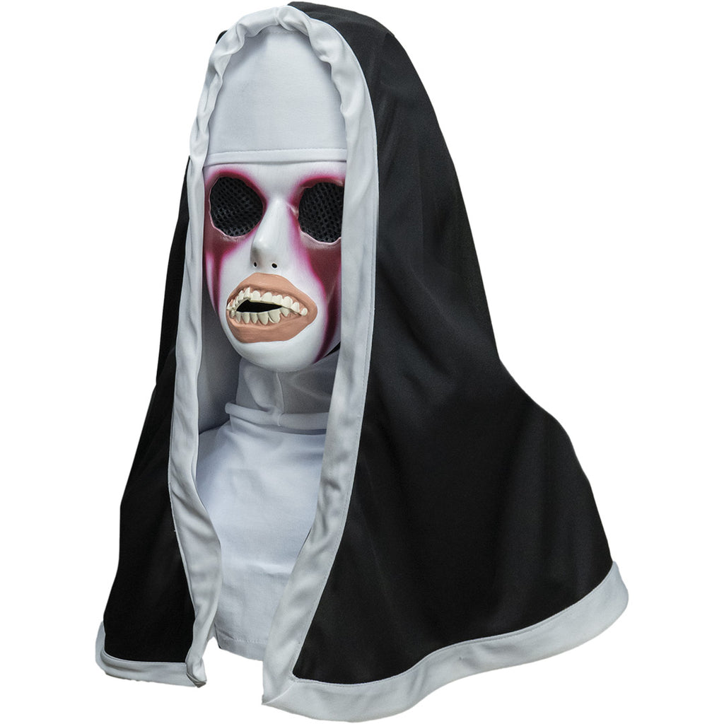 Plastic face mask and nun habit, head, neck and shoulders. Left view. White face, large black mesh covered eye holes, painted in dark red around eyes and dripping down face. Distorted mouth with large peach-colored lips, large crooked teeth. Wearing white trimmed black nun's habit over white head covering and shirt top