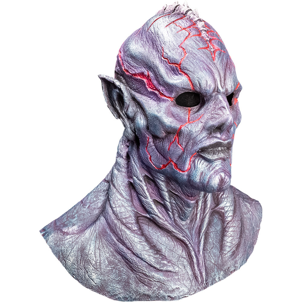 Mask, front right view, head, neck and upper chest. Silvery gray skin with bulging veins, bald with ridge on top of head, pointed ears, sharp cheekbones and cleft chin, red lines on head and face.