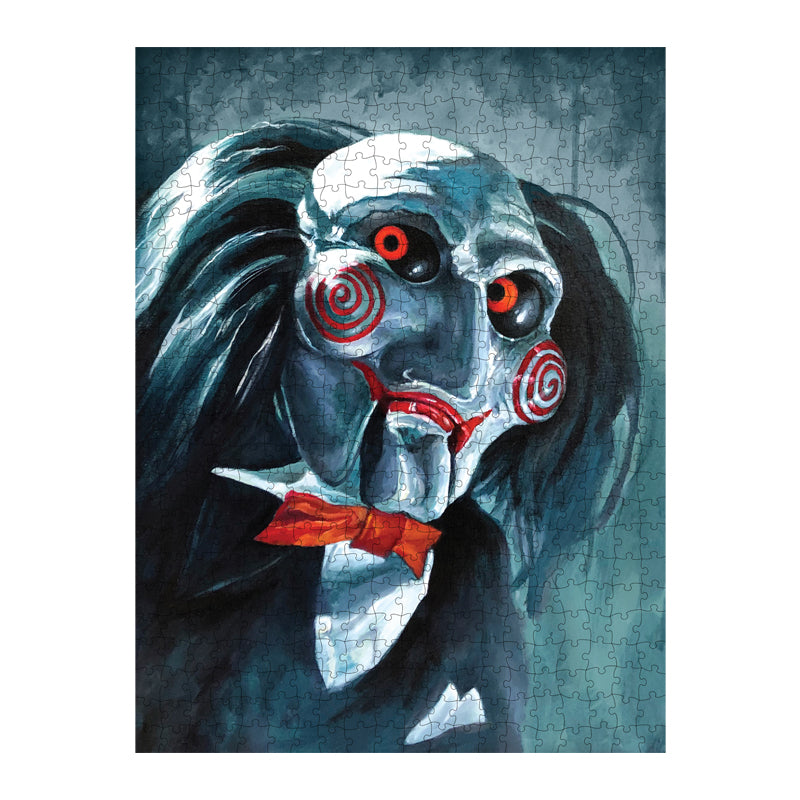 Completed puzzle. Illustration of the Saw Billy puppet head and shoulders, black and white background, balding with black hair, white face, black-rimmed red eyes, red spirals on cheeks, red lips on hinged ventriloquist dummy mouth. Wearing red bowtie, white collared shirt, black vest and suit coat.