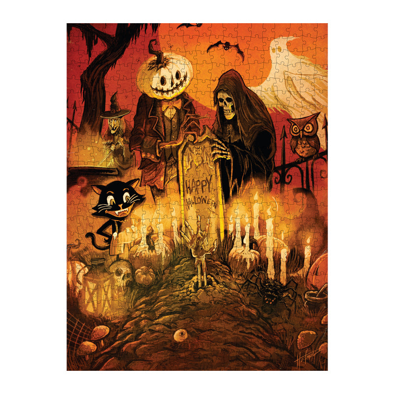 completed jigsaw puzzle. Illustration, orange, black and white cemetary scene. Skeleton in black robe and jack o' lantern creature in a suit with a bowtie standing behind gravestone with writing reading Happy Halloween, witch, bat ghost and owl in background, smiling cartoon-like black cat gazing at candles and skeletal hand rising out of a grave in the foreground.