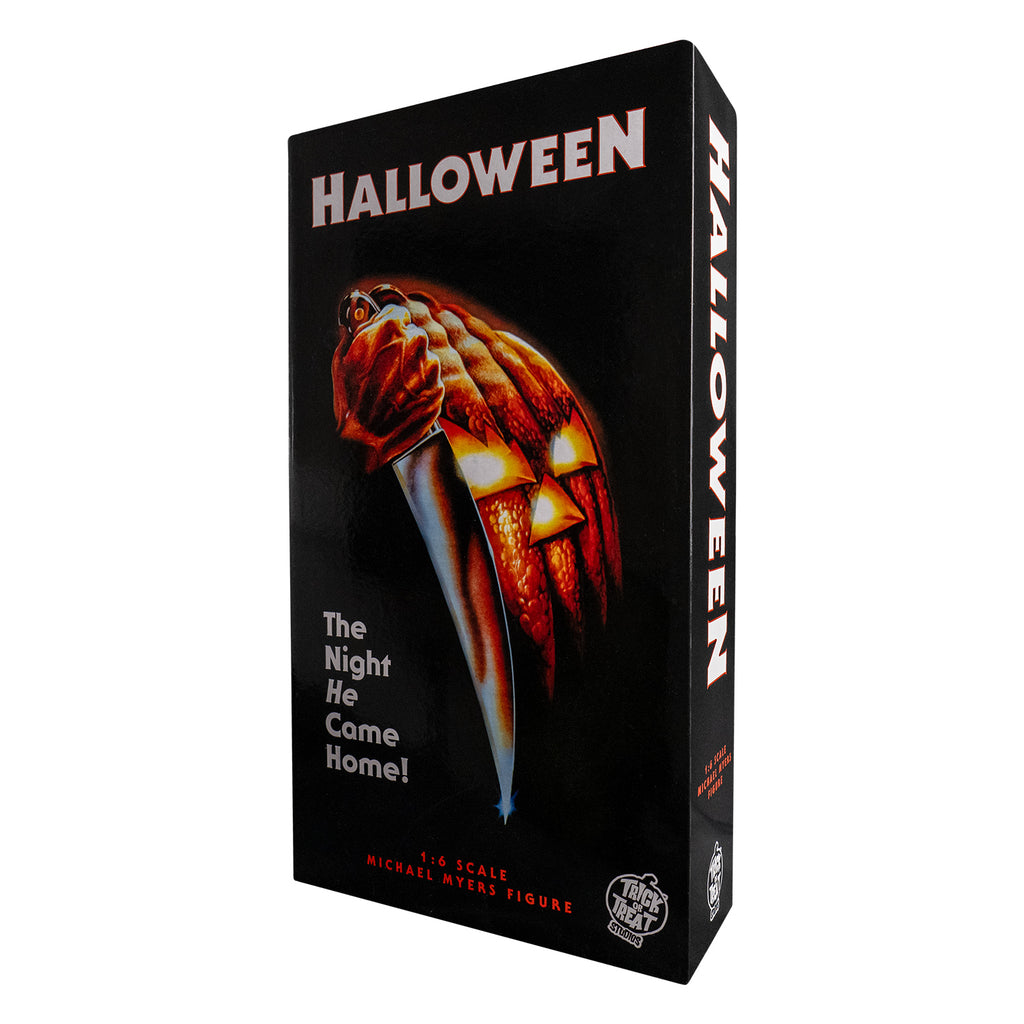 Product packaging front view.  Black box.  Illustration of Hand holding kitchen knife, next to orange and yellow carved jack o' lantern face. White text reads Halloween, The night he came home, red text reads 1:6 scale Michael Myers Figure.  White Trick or Treat Studios logo at bottom right.