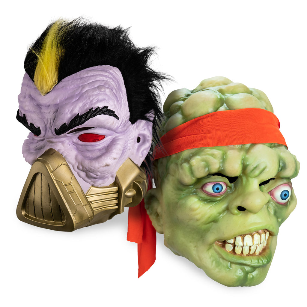 Two Halloween masks, one purple with black hair and gold armor, the other green with a red headband, on a white background.