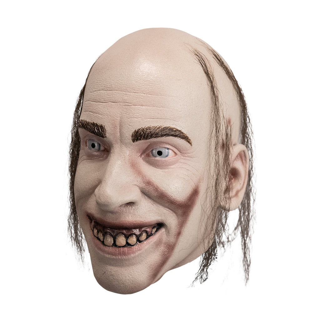 Latex mask of Man's face (Chop Top character) with stringy hair,  dirty teeth and blue eyes, left side view