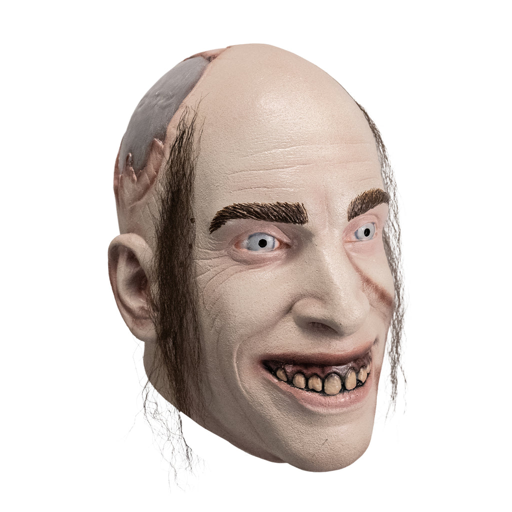 Latex mask of Man's face (Chop Top character) with stringy hair, painted faux metal skull plate detail, dirty teeth and blue eyes, right side view