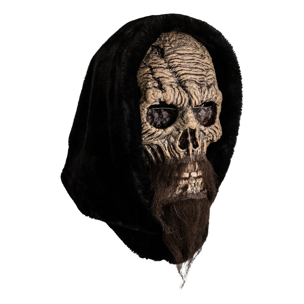 mask, right view. distressed skeletal face with long, dark brown beard, wearing black hood.