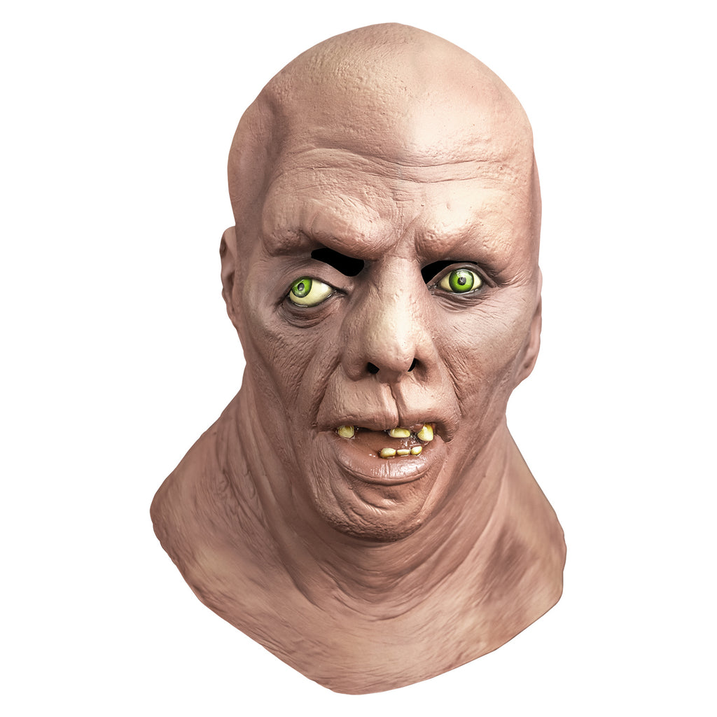 Mask, front view, head, neck and upper chest.  bald deformed head.  No eyebrows, light green eyes offset, right eye lower than the left.  Large misshapen nose.  left ear lower than right.  Mouth open showing pink tongue and only 6 teeth.