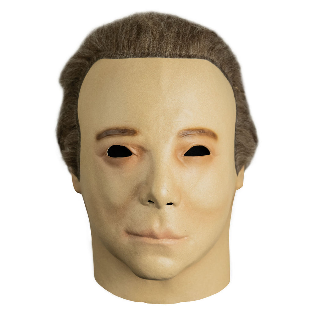 Mask, front view, head and neck.  short light brown hair, brown eyebrows.
