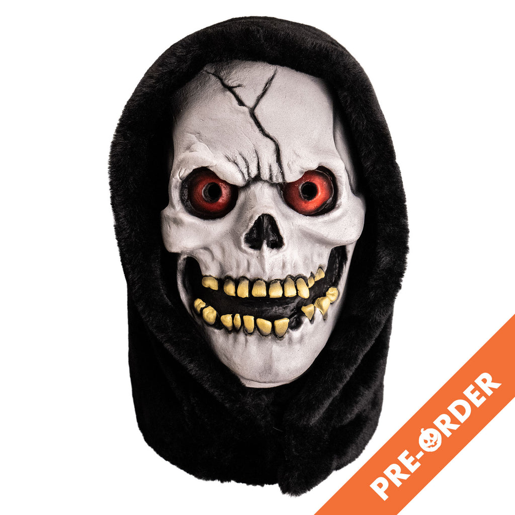 white background, orange diagonal banner at bottom right, white text reads pre-order.  mask, front view. white skull face with black crack in forehead, red eyes, open grinning mouth showing yellowed crooked teeth. wearing black hood.