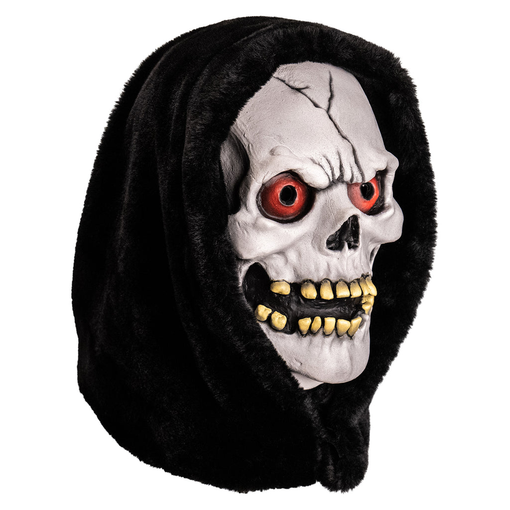 mask, right view. white skull face with black crack in forehead, red eyes, open grinning mouth showing yellowed crooked teeth. wearing black hood.