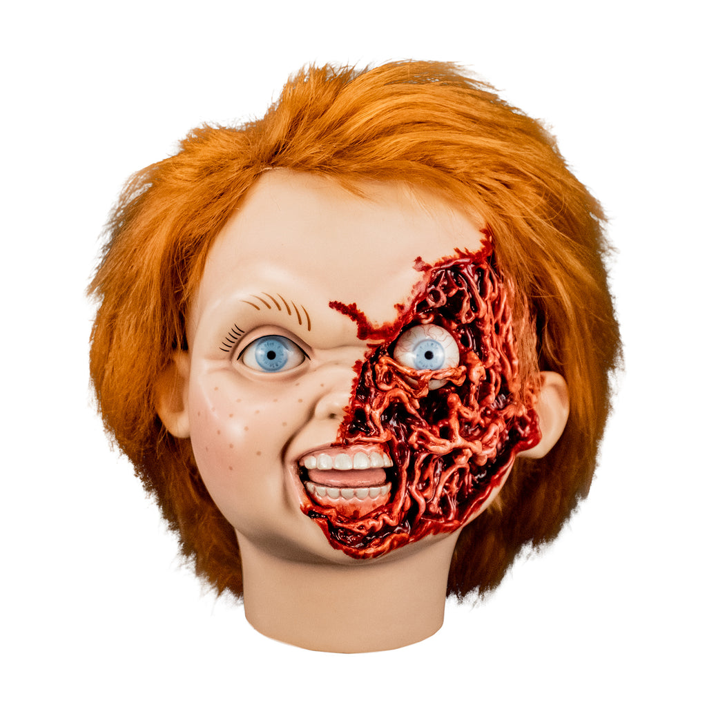 Ultimate Chucky Pizza Face additional head, front view.  Red hair, blue eyes, freckles.  Gory, fleshy left side of face, exposed eyeball.  Mouth open, showing teeth and tongue.  