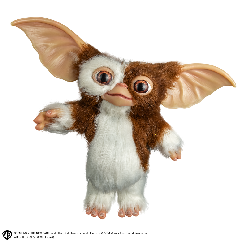 Gizmo mogwai prop, front view, full body, brown and white fur large brown eyes, large pointed tan ears.  Hairless hands and feet.