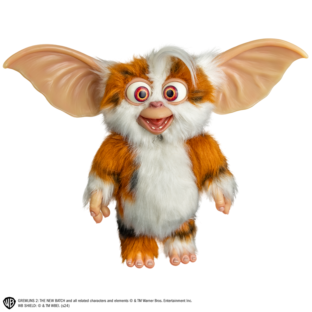 Gremlins 2 prop - Mogwai  Daffy, full body, standing, front view, brown and white with some black fur, large crossed eyes, mouth open in a smile, large pointed tan ears. Hairless hands and feet.