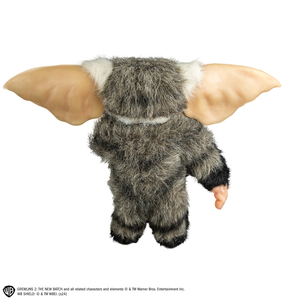 George mogwai prop, back view, full body, black, gray and white fur, large pointed tan ears.  Hairless hands and feet. 