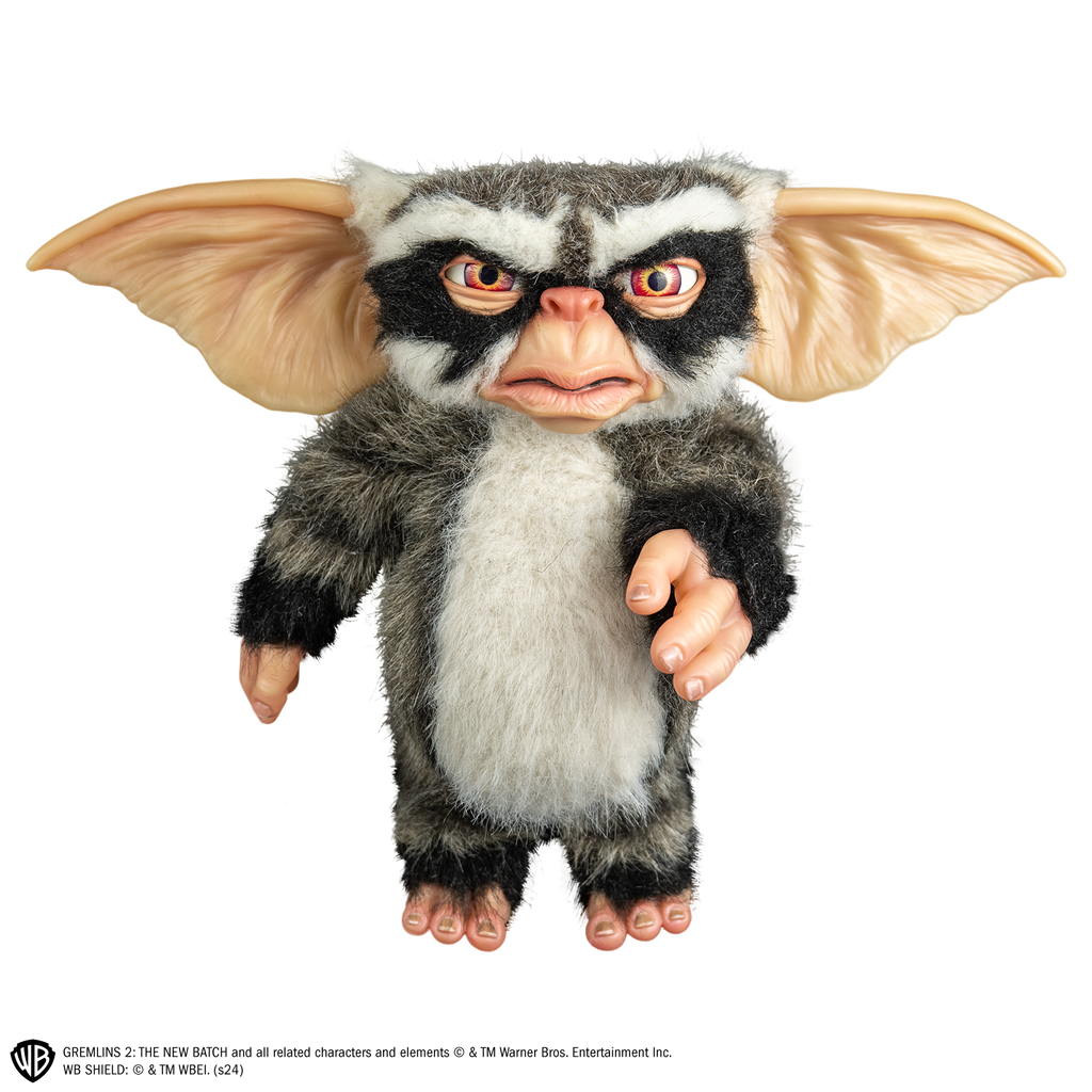 George mogwai prop, front view, full body, black, gray and white fur. angry face, large brown eyes, large pointed tan ears.  Hairless hands and feet. 