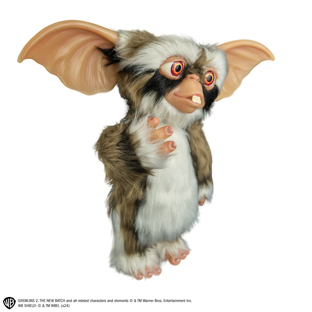 Lenny mogwai prop, right view, full body, black, light brown and white fur. buck teeth, large brown eyes, large pointed tan ears.  Hairless hands and feet. 