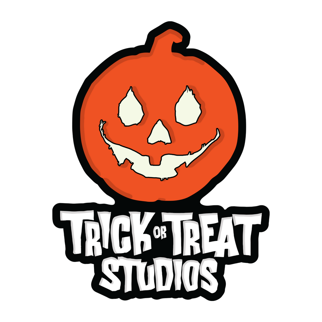 Enamel Pin. black outlined, Orange Jack o' lantern with white eyes, nose and smiling smiling mouth, above white text that reads Trick or Treat Studios. 