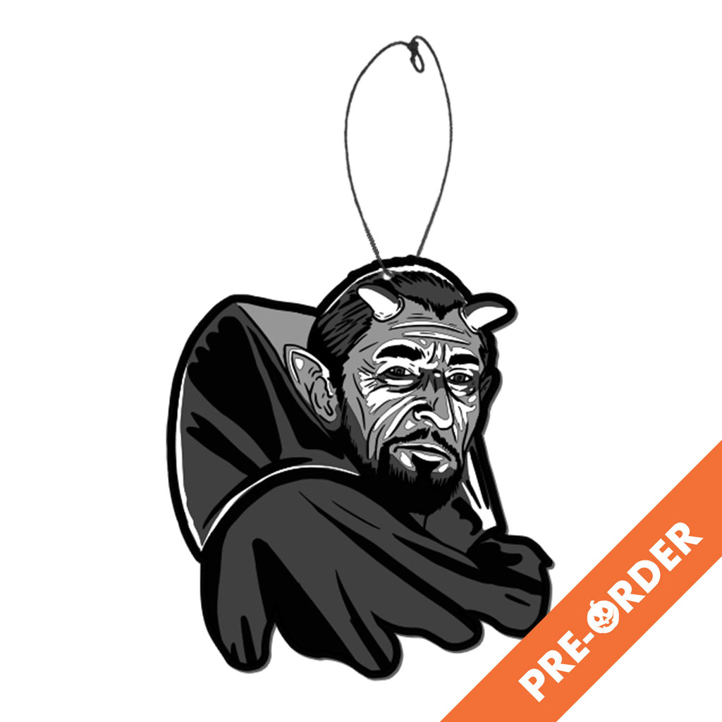 white background, orange diagonal banner at bottom right, white text reads pre-order.  air freshener. Black and white illustration. Man head and shoulders. Dark hair, 2 horns on head, large pointy ears, beard and moustache, wearing high-collared cape.