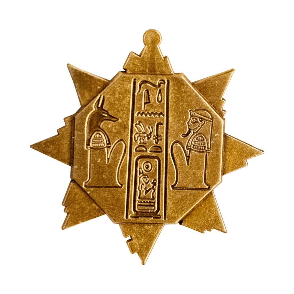 enamel pin.  golden key, 8 pointed star shape adorned with Egyptian hieroglyphs