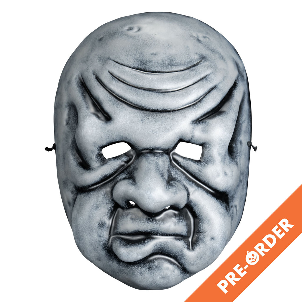 White background, orange diagonal banner at bottom right, white text reads pre-order. Mask, front view. Black and white toned face mask. Bald, wrinkles on forehead, no eyebrows, bags under small eyes, short fat nose, heavy jowls, mouth with misshapen  lower lip.