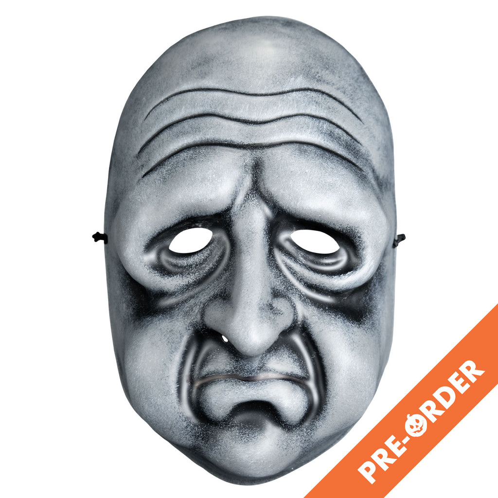 White background, orange diagonal banner at bottom right, white text reads pre-order.  Mask, front view. Black and white toned face mask. Bald, wrinkles on forehead, no eyebrows, bags under eyes, long nose, round cheeks and chin, mouth in a frown with prominent lower lip .