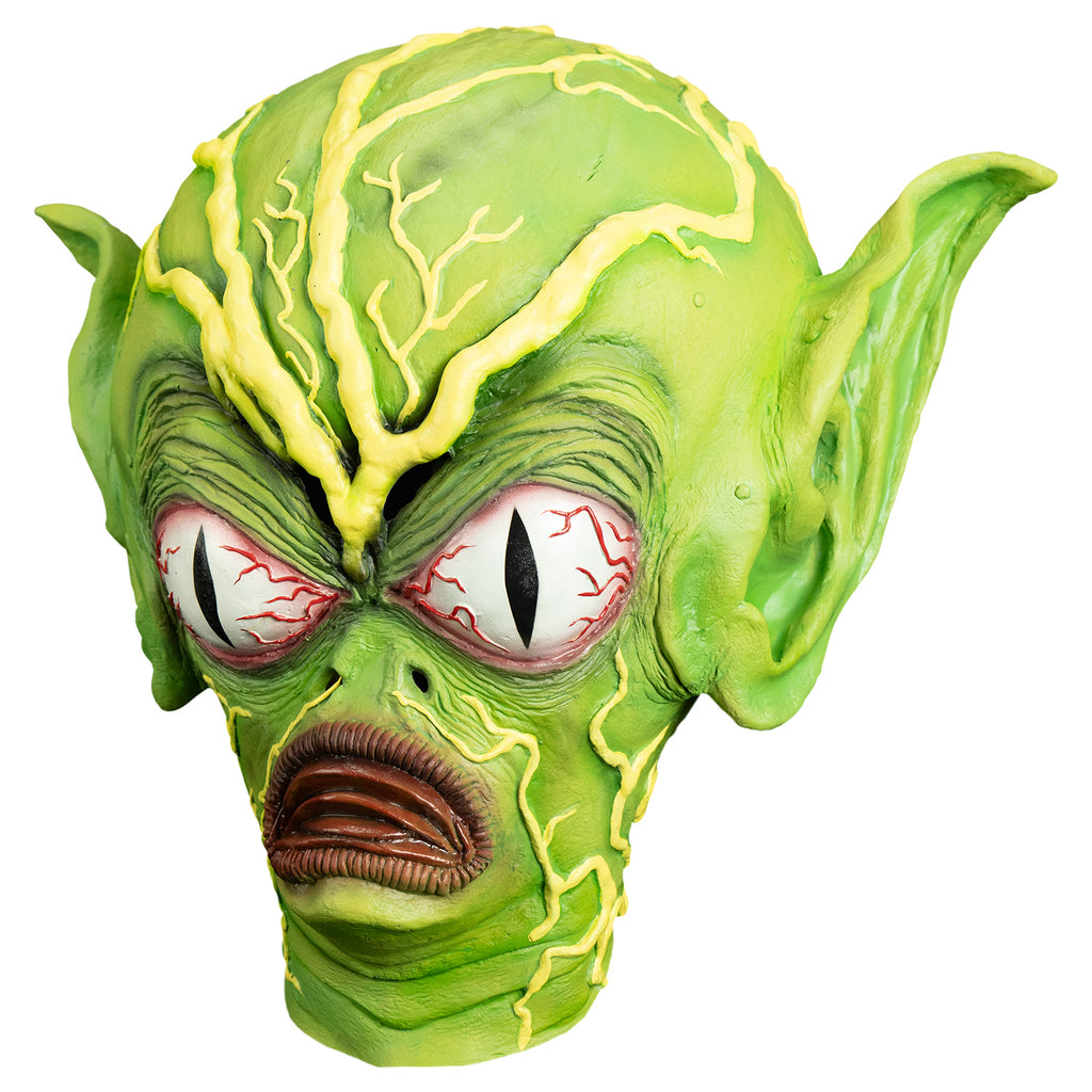 Mask, left view.  Bright green flesh. yellow green veins large on forehead and top of enlarged head, smaller yellow veins on forehead cheeks and neck.  Very large pointed ears.  Very large bloodshot white eyes with vertical black pupils. wrinkled skin around eyes.  two holes for nostrils.  small chin.  red frowning mouth 