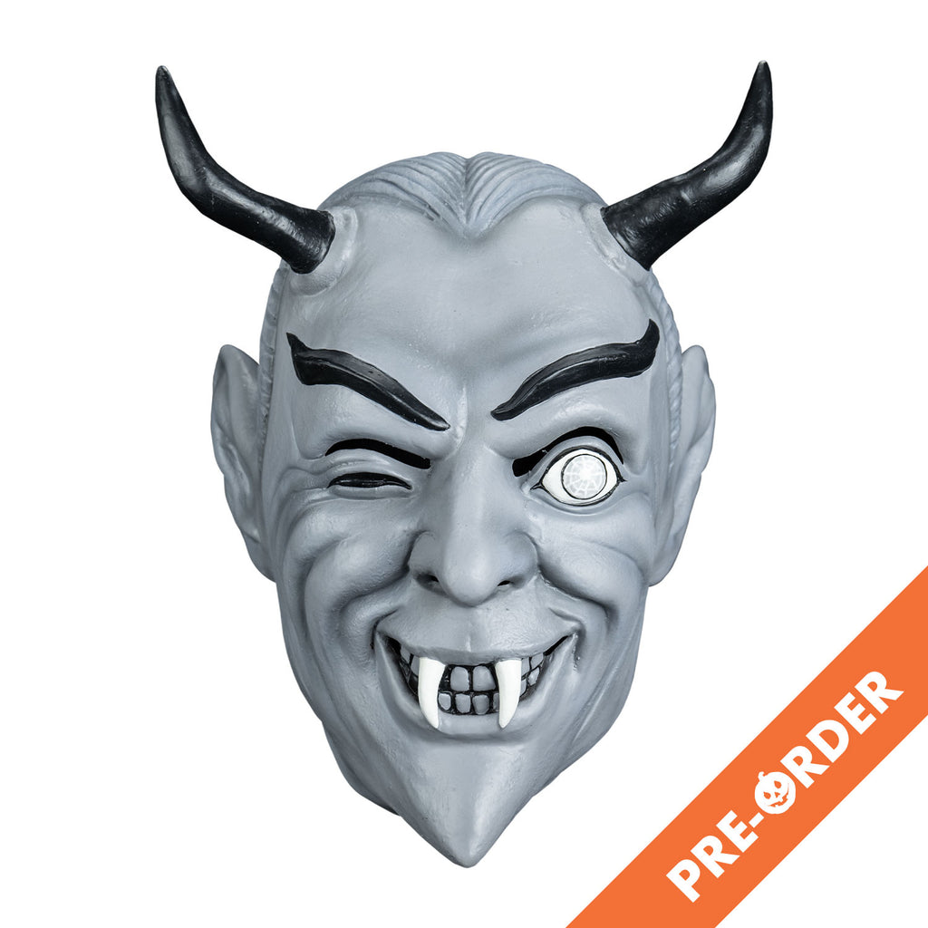 White background, orange diagonal banner at bottom right, white text reads pre-order. Mask, front view. Black and white toned. Gray slicked-back hair, black horns on forehead, Black eyebrows, dark slightly closed right eye, left eye wide open, smiling mouth, two white fangs.