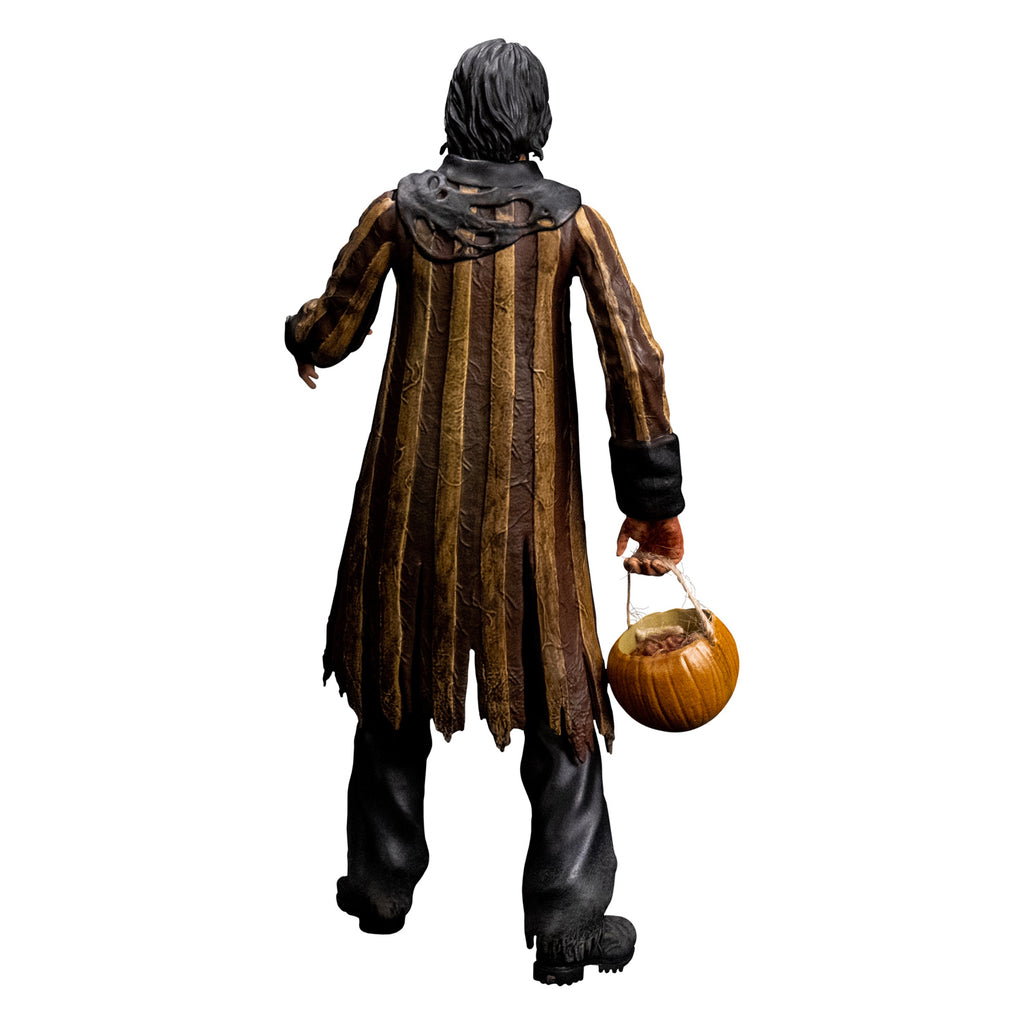 Jacob Atkins figure back view, man with dark slicked back hair. Wearing a bloodstained white shirt, brown and tan striped tattered coat with black cuffs and collar, black pants, black shoes. holding pumpkin candy pail in right hand.