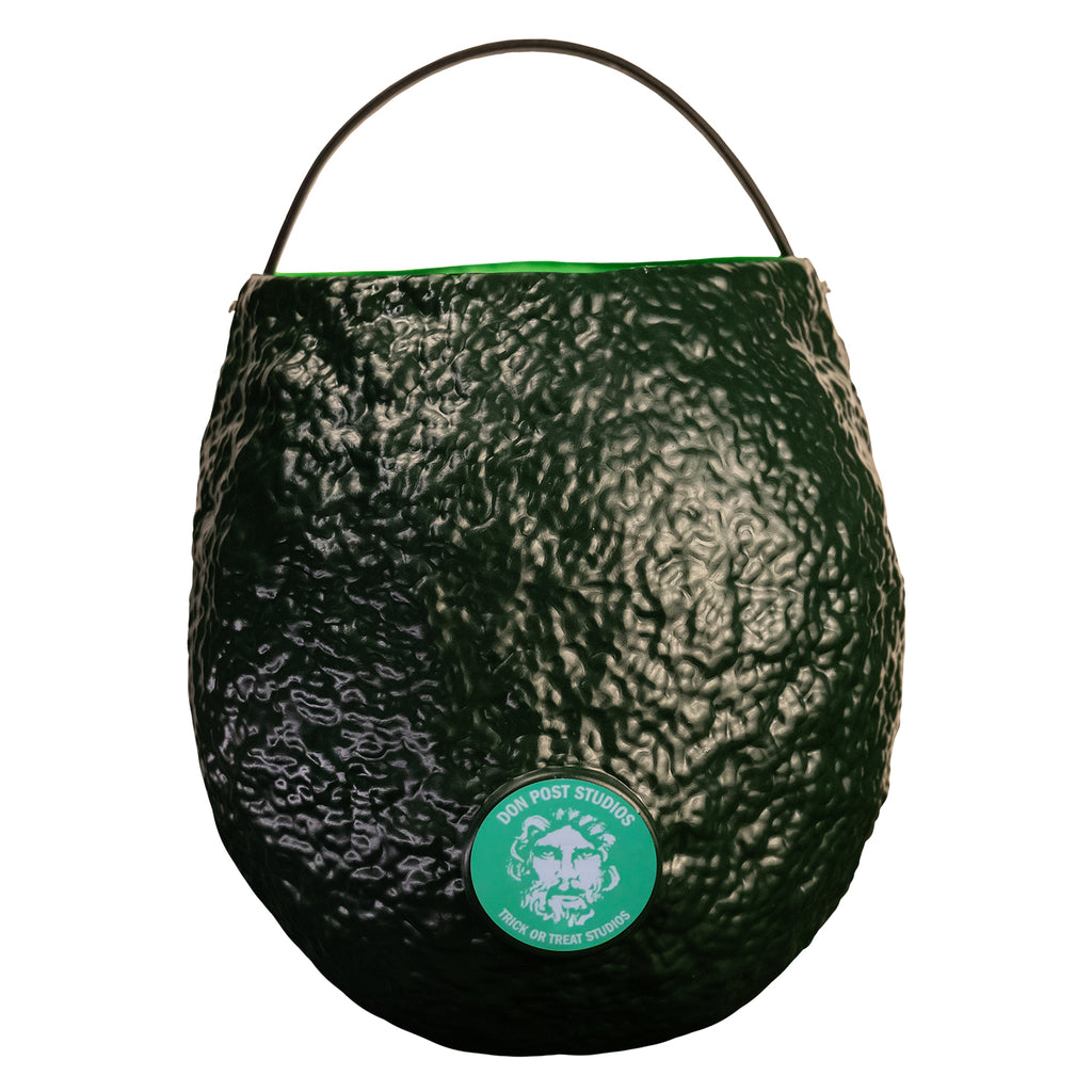 Back view, witch candy pail. Dark green with Light green-blue circle near the bottom in the center, illustration of face,  white text reads Don Post Studios, Trick or treat studios.