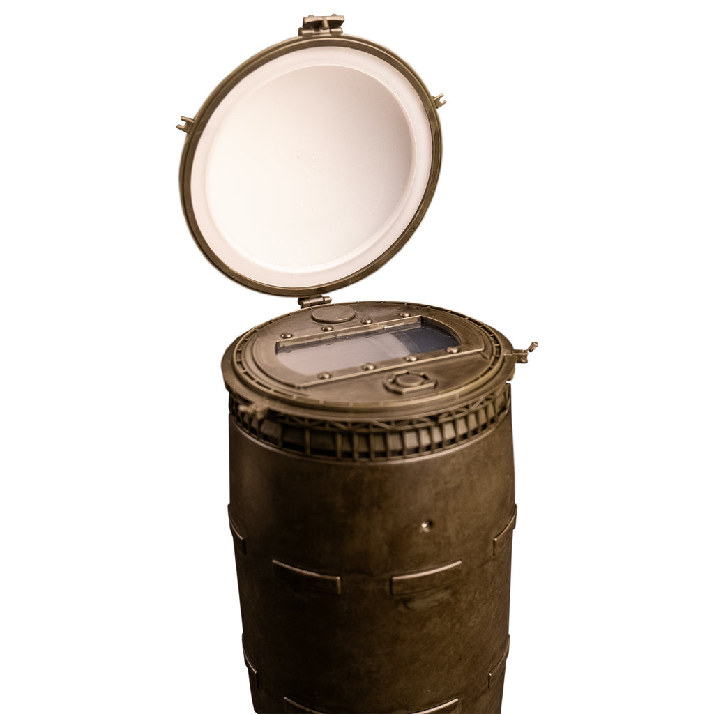 Closeup view of barrel. showing white wide open lid, latches and window under lid