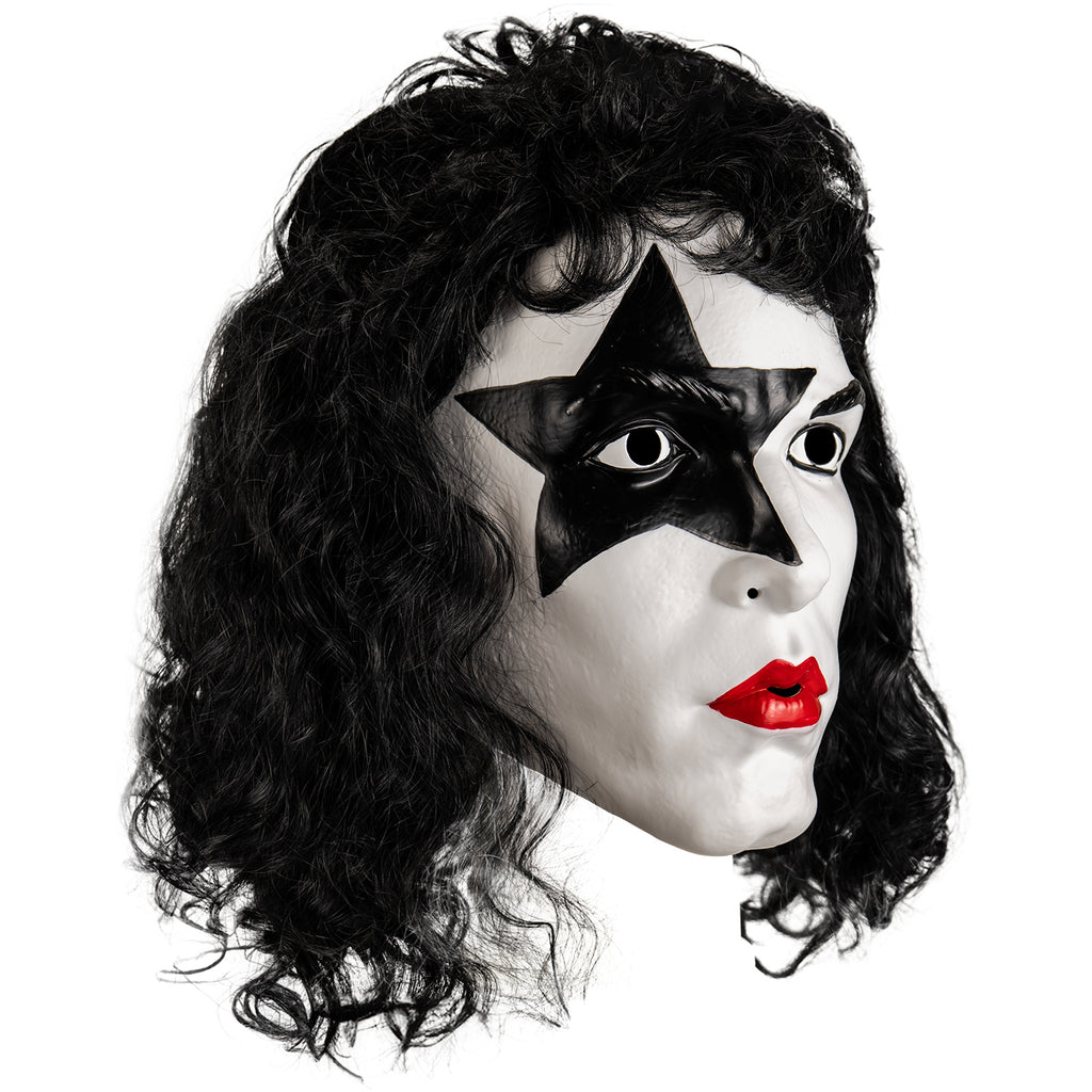 Kiss Starchild plastic mask right side view. Long black curly hair with bangs, white face, black star painted over right eye. Black eyebrow and eye with black eyeliner on left eye, bright red lipstick