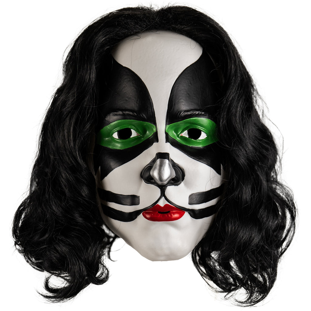  Kiss Catman plastic mask front view. Long black curly hair, white face, green around both eyes surrounded with black painted shapes from the edges of the forehead to the cheekbones, black and silver painted nose, black whisker-like lines next to mouth. bright red lipstick