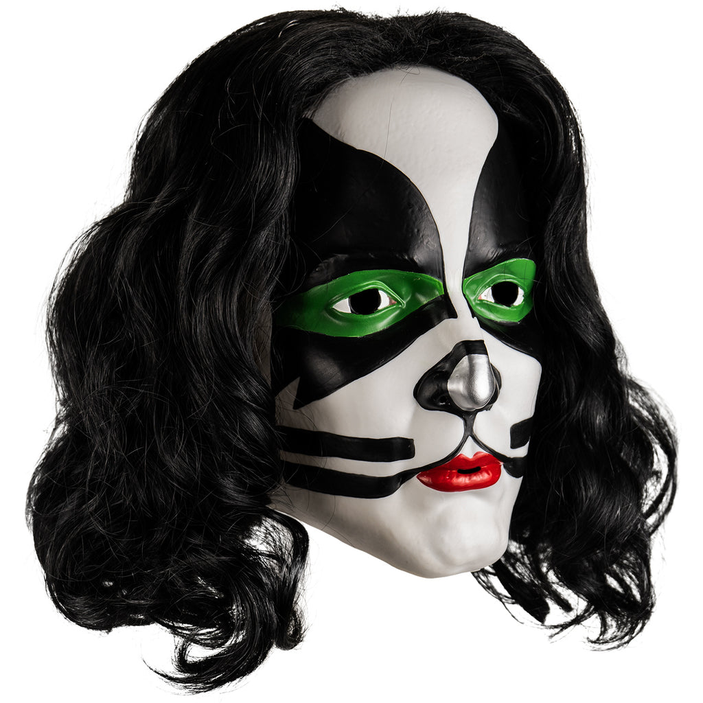 Kiss Catman plastic mask right view. Long black curly hair, white face, green around both eyes surrounded with black painted shapes from the edges of the forehead to the cheekbones, black and silver painted nose, black whisker-like lines next to mouth. bright red lipstick