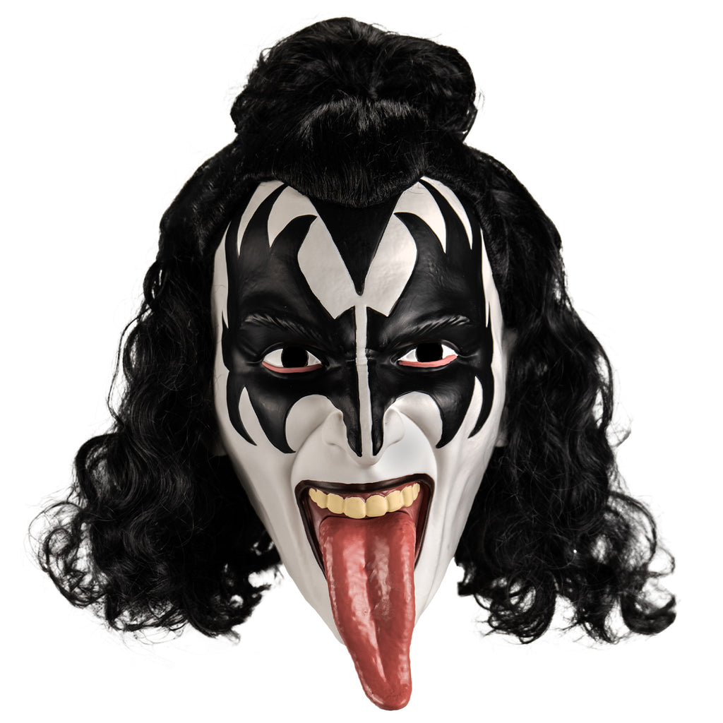 Kiss plastic mask front view.  Black curly hair, front half in a bun at the forehead.  White face, black painted widow's peak on forehead, black painted demon wings over eyes forehead and cheeks.  Black lips, mouth wide open showing upper teeth and long tongue hanging out.