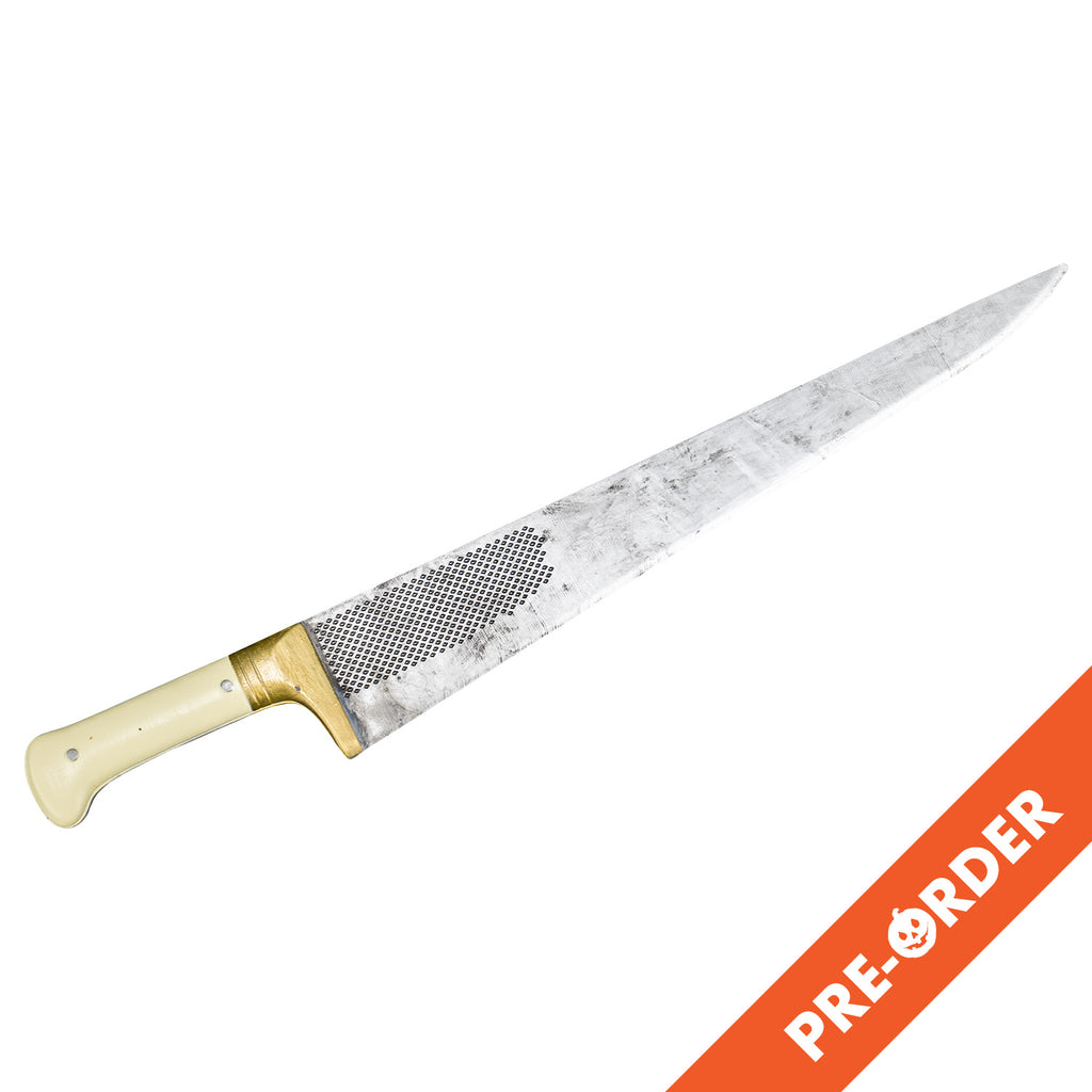 white background, orange diagonal banner bottom right, white text reads pre-order.  Knife prop. cream colored and brass handle, long silver blade