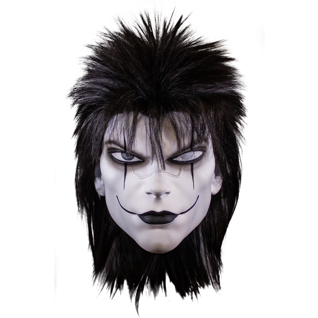 plastic mask, front view. straight black mullet with spiky hair on top. white skin black make-up on eyes and lips, black lines drawn down from the center of the lower eyelids, and lines drawn up across cheeks from the corners of the mouth.