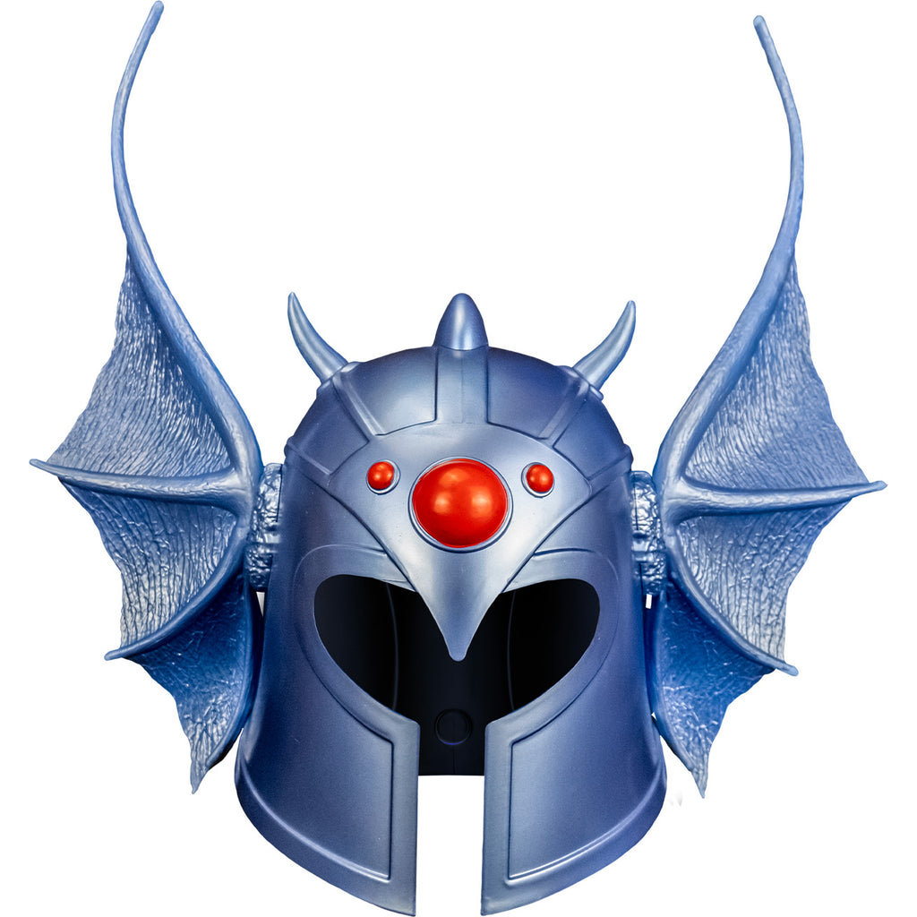 white background. Warduke helmet front view. Metallic silvery blue helmet with dragon wing style ears on the sides, 1 large red gem in the center of the forehead and 2 smaller red gems on either side.