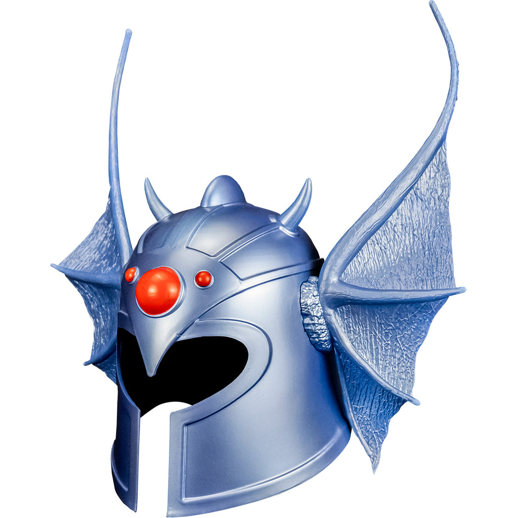 white background. Warduke helmet left side view. Metallic silvery blue helmet with dragon wing style ears on the sides, 1 large red gem in the center of the forehead and 2 smaller red gems on either side.