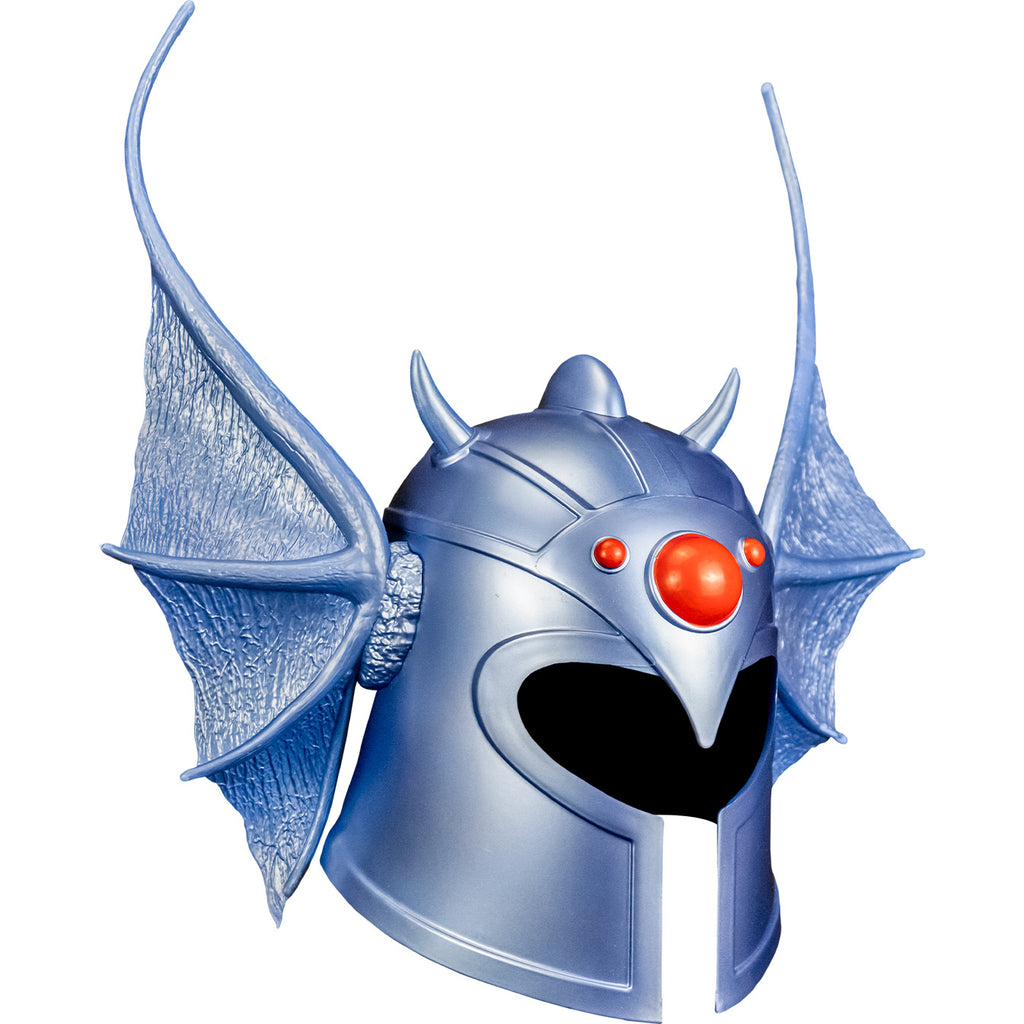 white background. Warduke helmet right side view. Metallic silvery blue helmet with dragon wing style ears on the sides, 1 large red gem in the center of the forehead and 2 smaller red gems on either side.