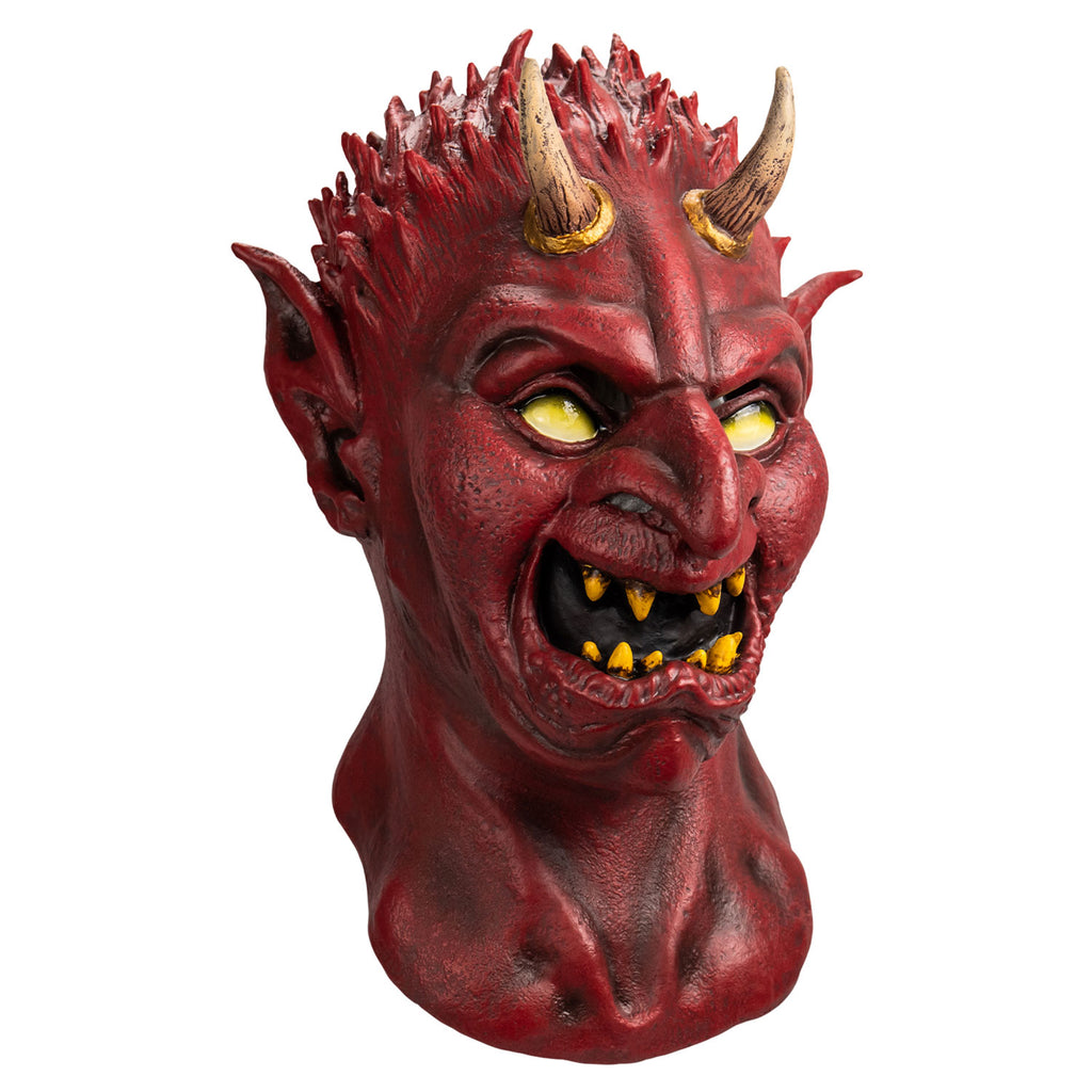 Mask, slight right view, head and neck. Red flesh, small red spikes on head like hair, two tan horns at top of forehead, no eyebrows, pointed ears, yellow eyes, large pointed nose, mouth open in a sneer, sharp yellow teeth.