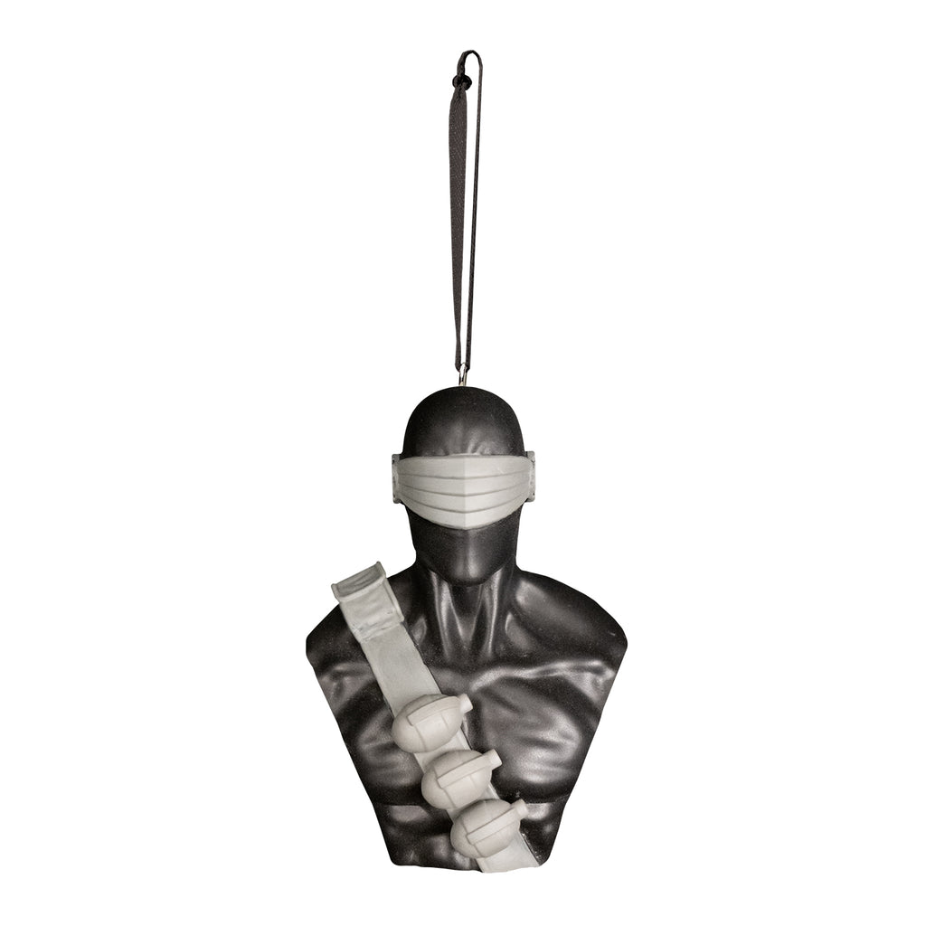 ornament, front view. Bust of G I Joe Snake Eyes, head shoulders and chest. Wearing skin-tight metallic black suit, gray visor over eyes and nose area,  black ammunition band across chest with 3 hand grenades. Black cord at top for hanging.