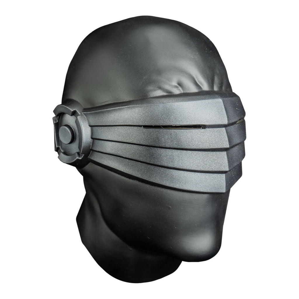 Mask, right side view. Metallic dark gray head, wrinkled brow, with silver shield over eyes, ears and nose.