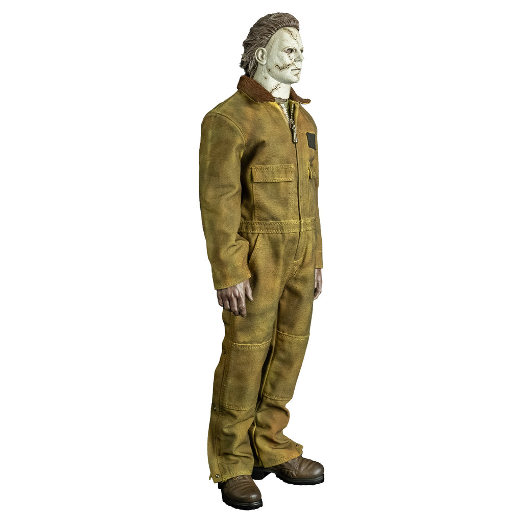 Right side view, Michael Myers 1:6 scale action figure. Wearing Halloween 2007 mask, tan coveralls, brown boots. hands at sides