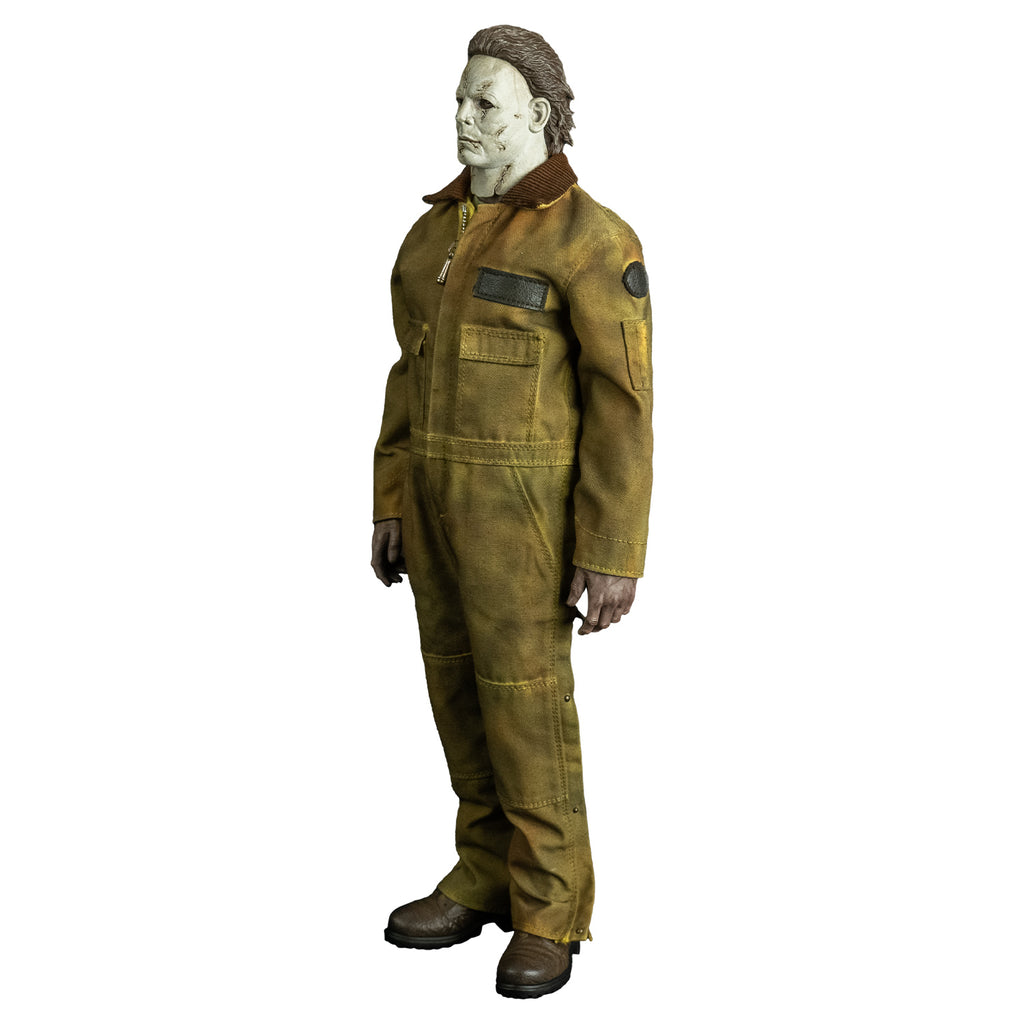 left side view, Michael Myers 1:6 scale action figure. Wearing Halloween 2007 mask, tan coveralls, brown boots. hands at sides