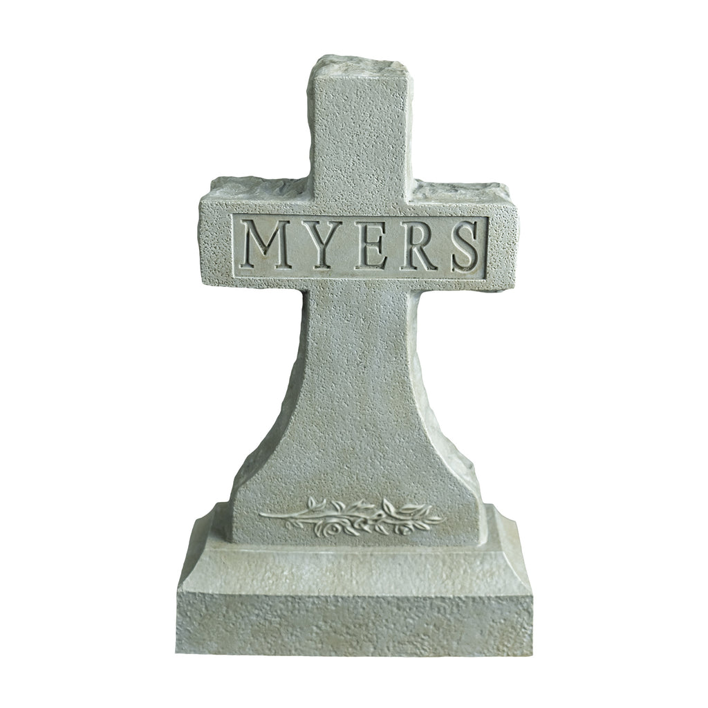 front view, Tombstone accessory. Gray cross tombstone, texts reads Myers, decorative details at bottom.