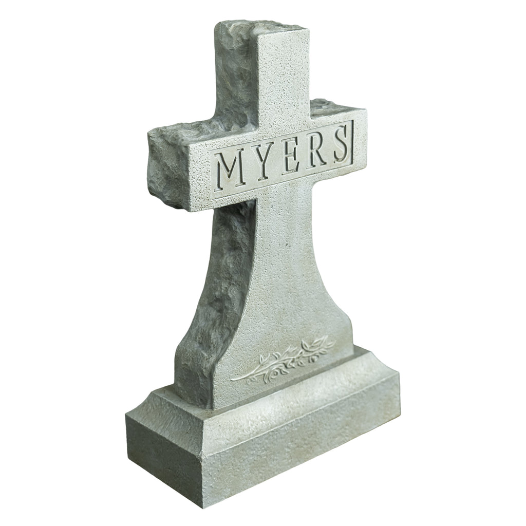 Left side view, Tombstone accessory. Gray cross tombstone, texts reads Myers, decorative details at bottom.