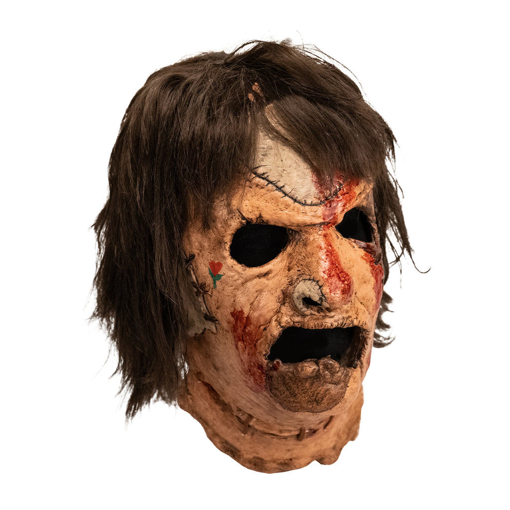 Leatherface latex mask with hair and faux blood splatter, side view